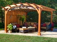 wooden arched pergola with privacy wall