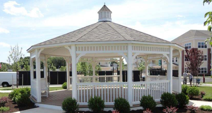 white vinyl dodecagon gazebo in a picturesque courtyard