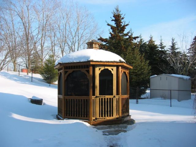 10 foot wooden octagon gazebo covered in snow