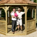 wooden 12 foot octagon gazebo with happy friends standing in the front