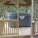 wooden 12 by 16 foot rectangle gazebo with hot tub
