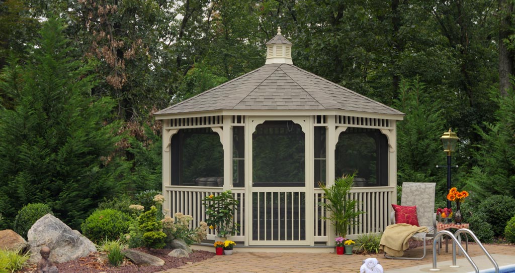 cream coloured octagon gazrbo in picturesque backyard